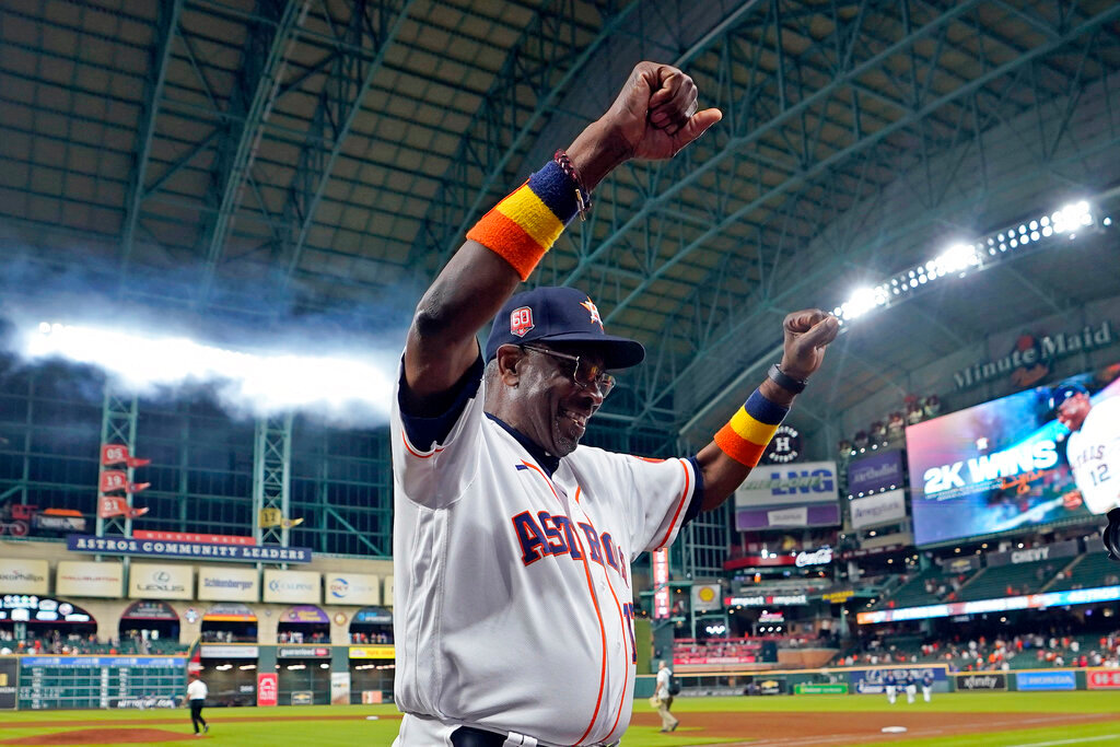 Houston Astros manager Dusty Baker Jr. (12) celebrates after a baseball game against the Seattle Mariners Tuesday, May 3, 2022, in Houston. Baker won his 2,000th game Tuesda, becoming the 12th skipper in major league history to reach the milestone and the first Black man to do it. (AP Photo/David J. Phillip)