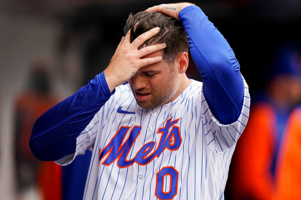 New York Mets relief pitcher Adam Ottavino (0) reacts in the dugout after being relieved in the sixth inning inning against the Atlanta Braves, Wednesday, May 4, 2022, in New York. Ottavino gave up five runs to the Braves. (AP Photo/John Minchillo)