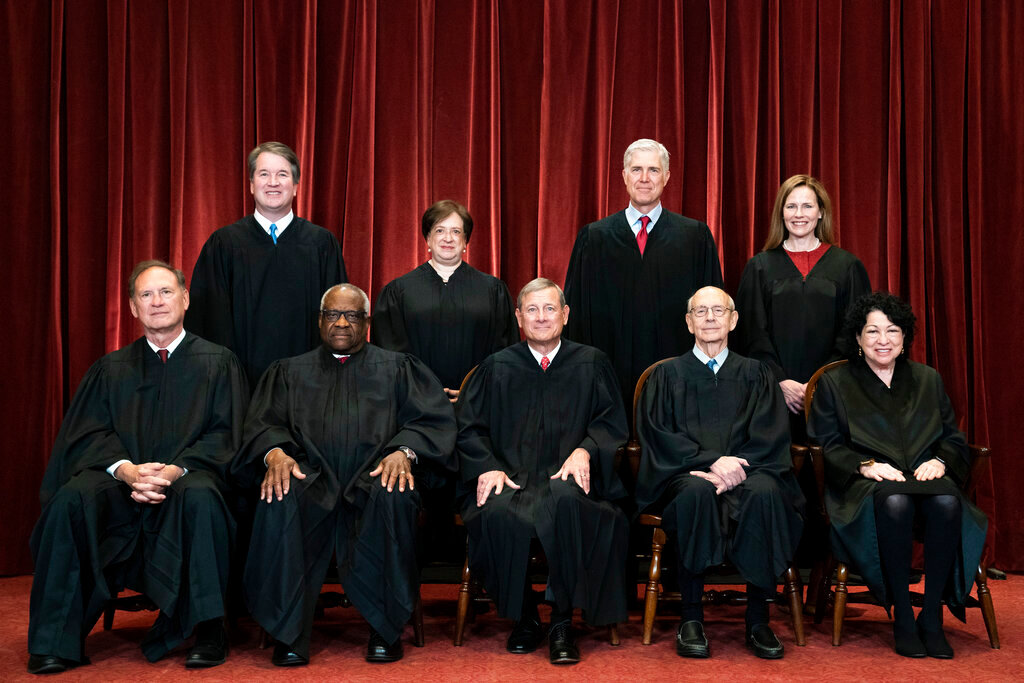 Members of the Supreme Court pose for a group photo at the Supreme Court in Washington, April 23, 2021. Seated from left are Associate Justice Samuel Alito, Associate Justice Clarence Thomas, Chief Justice John Roberts, Associate Justice Stephen Breyer and Associate Justice Sonia Sotomayor, Standing from left are Associate Justice Brett Kavanaugh, Associate Justice Elena Kagan, Associate Justice Neil Gorsuch and Associate Justice Amy Coney Barrett. (Pool Photo/Erin Schaff, The New York Times via AP)