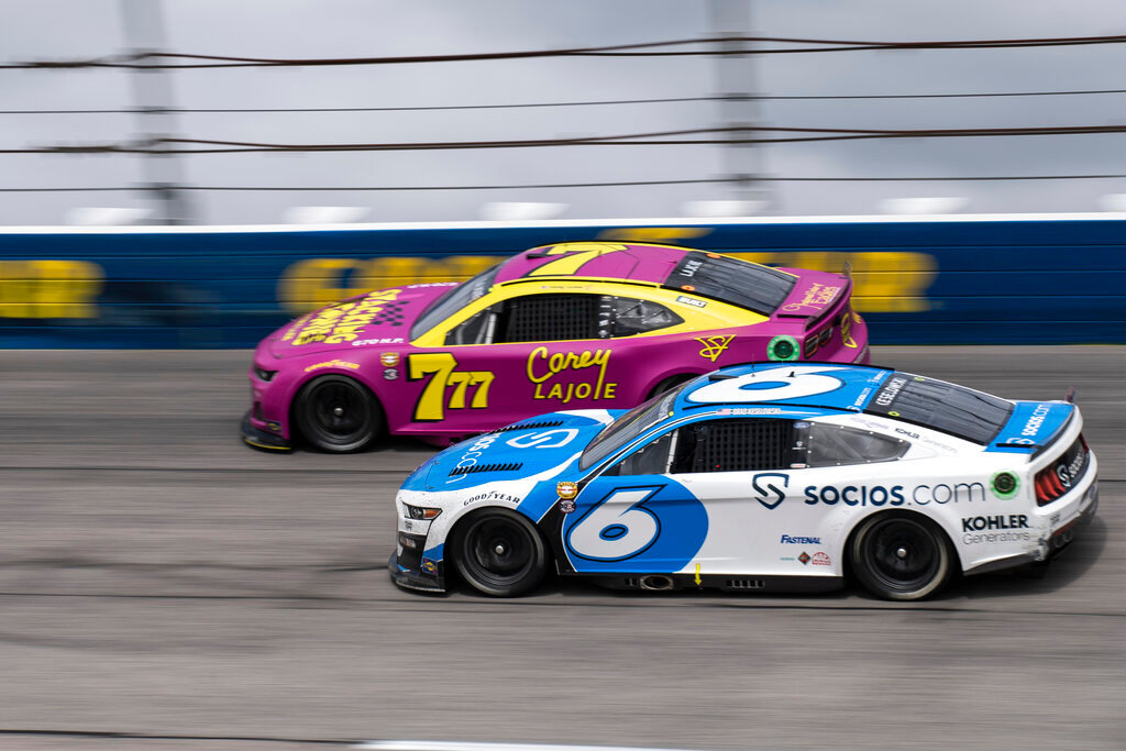 Brad Keselowski (6) looks to pass Corey LaJoie (7) in turn two during a NASCAR Cup Series auto race at Darlington Raceway, Sunday, May 8, 2022, in Darlington, S.C. (AP Photo/Matt Kelley)