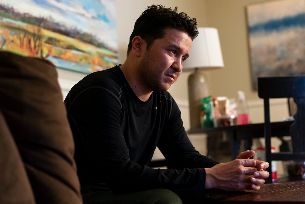 Hasibullah Hasrat, 29, is interviewed at his apartment, in Hyattsville, Md., Wednesday, May 4, 2022. (AP Photo/Jacquelyn Martin)