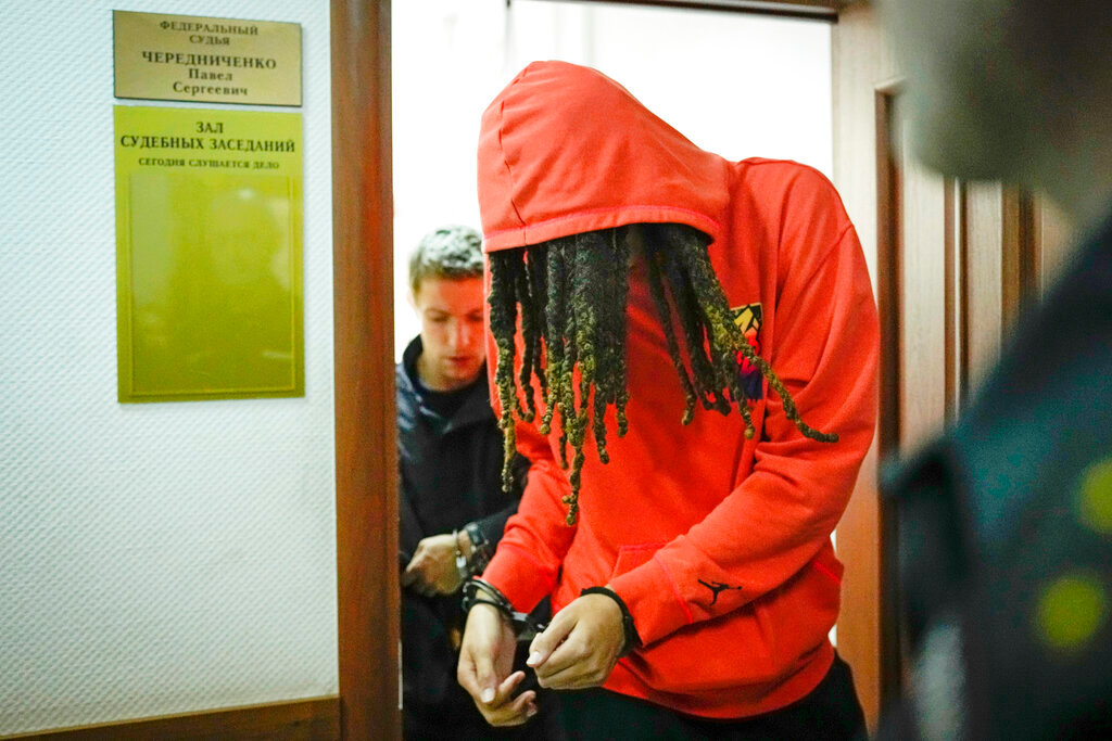 WNBA star and two-time Olympic gold medalist Brittney Griner leaves a courtroom in Khimki just outside Moscow, Russia, Friday, May 13, 2022. (AP Photo/Alexander Zemlianichenko)