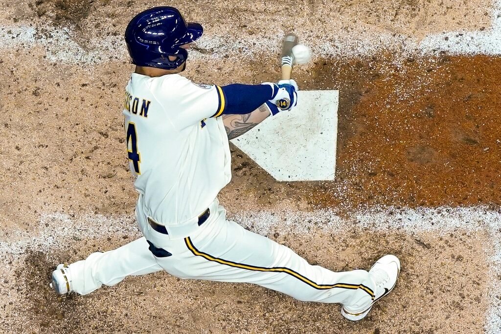 Milwaukee Brewers' Jace Peterson hits a single during the seventh inning against the Atlanta Braves, Monday, May 16, 2022, in Milwaukee. (AP Photo/Morry Gash)