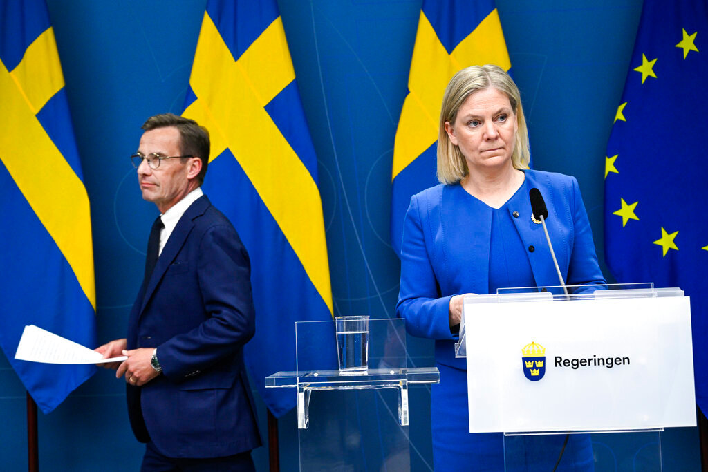 Sweden's Prime Minister Magdalena Andersson, right, and Moderate Party leader Ulf Kristersson give a news conference in Stockholm, Sweden, Monday, May 16, 2022. Sweden's government has decided to apply for a NATO membership. (Henrik Montgomery/TT News Agency via AP)