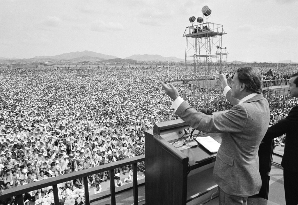 American evangelist Billy Graham preaches to over half a million South Koreans at a plaza on Yoido islet in Seoul, June 3, 1973. (AP Photo)