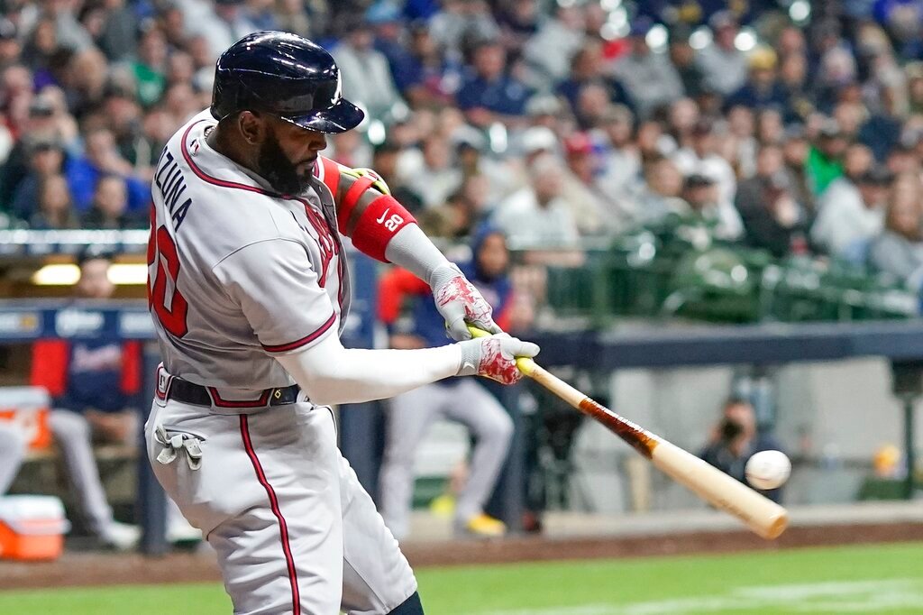 Atlanta Braves' Marcell Ozuna hits a two-run home run during the eighth inning against the Milwaukee Brewers, Tuesday, May 17, 2022, in Milwaukee. (AP Photo/Morry Gash)