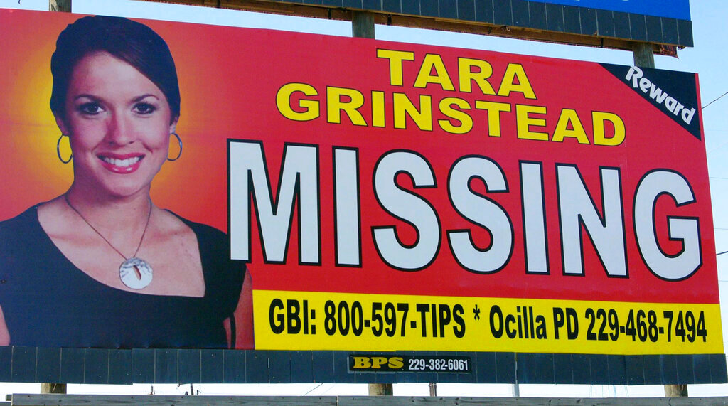 Missing teacher Tara Grinstead is displayed on a billboard in Ocilla, Ga. (AP Photo/Elliott Minor, File)