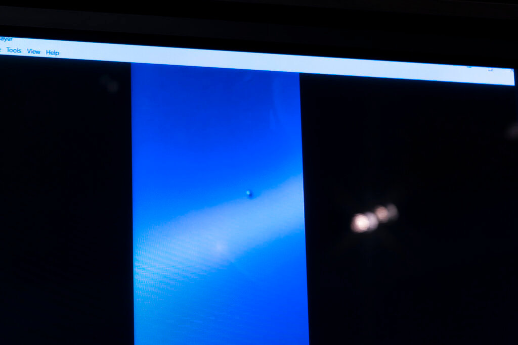 A video showing an "unidentified aerial phenomena," or UAP, is paused for display during a House subcommittee hearing on Capitol Hill, Tuesday, May 17, 2022, in Washington. (AP Photo/Alex Brandon)