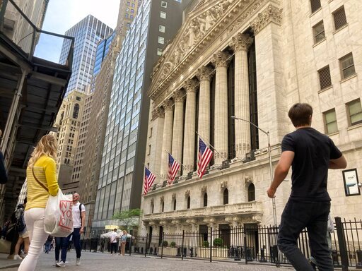 Pedestrians walk past the New York Stock Exchange, May 18, 2022 in New York. (AP Photo/Peter Morgan, File)
