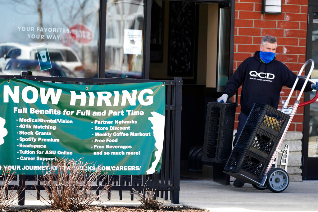 A hiring sign is displayed outside of a Starbucks in Schaumburg, Ill., April 1, 2022. (AP Photo/Nam Y. Huh, File)