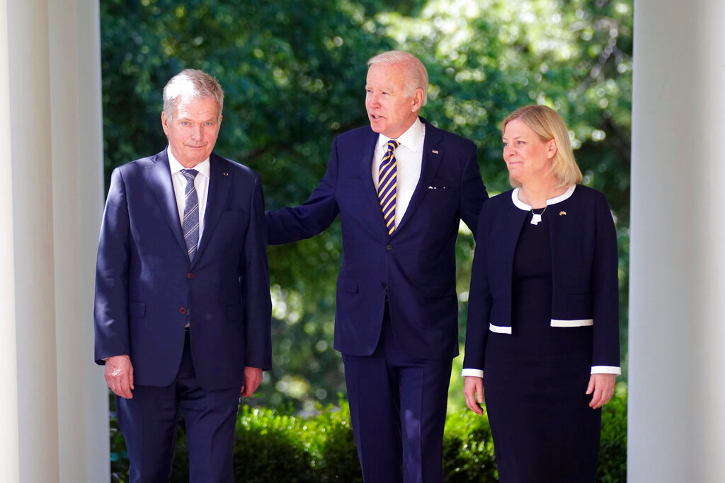 President Joe Biden, accompanied by Swedish Prime Minister Magdalena Andersson and Finnish President Sauli Niinisto, left, walks out to speak in the Rose Garden of the White House in Washington, Thursday, May 19, 2022. (AP Photo/Andrew Harnik)