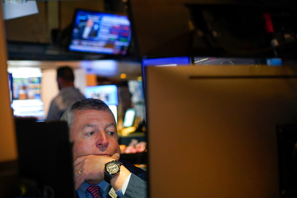 A trader works on the floor at the New York Stock Exchange in New York, Thursday, May 19, 2022. (AP Photo/Seth Wenig)