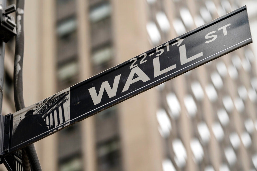 A street sign for Wall Street in the Manhattan borough of New York. (AP Photo/John Minchillo, File)