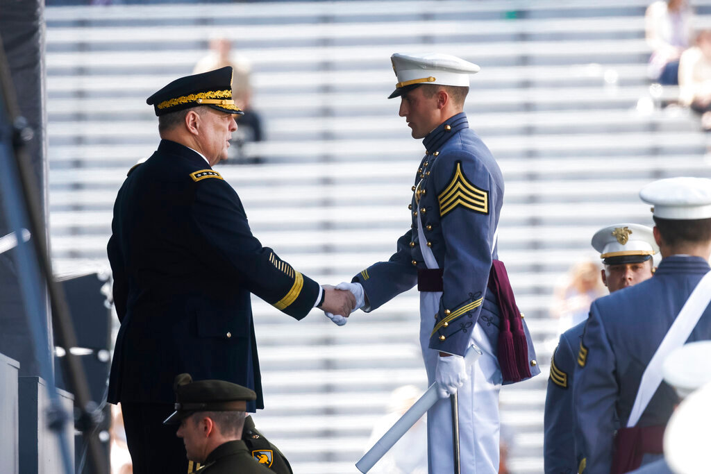 Mark A. Milley, chairman of the Joint Chiefs of Staff, shakes the hands of West Point graduates as they receive their diplomas during the graduation ceremony of the U.S. Military Academy class of 2022 at Michie Stadium on Saturday, May 21, 2022, in West Point, N.Y. (AP Photo/Eduardo Munoz Alvarez)