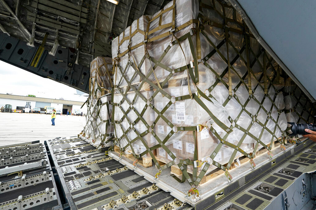The 132 pallets of Nestlé Health Science Alfamino Infant and Alfamino Junior formula are shown in the cargo hold of a C-17 plane at the Indianapolis International Airport in Indianapolis, Sunday, May 22, 2022. (AP Photo/Michael Conroy)