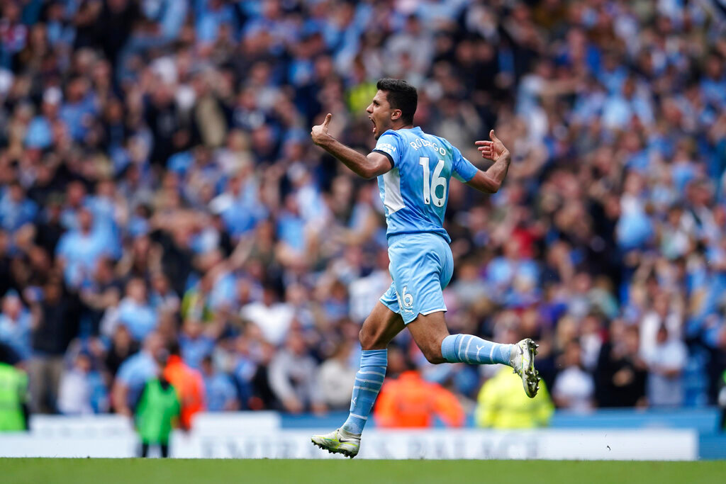 Manchester City's Rodrigo celebrates after scoring his side's second goal during the English Premier League soccer match between Manchester City and Aston Villa in Manchester, England, Sunday, May 22, 2022. (AP Photo/Dave Thompson)