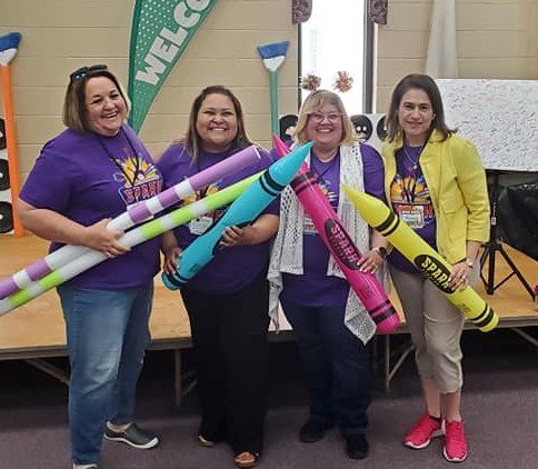 Jenni Carter, Natalie Hernandez, Glenda Torres, and Rossy Rivera, from left, pose at a Spanish-language VBS training session in Reidsville, Ga.