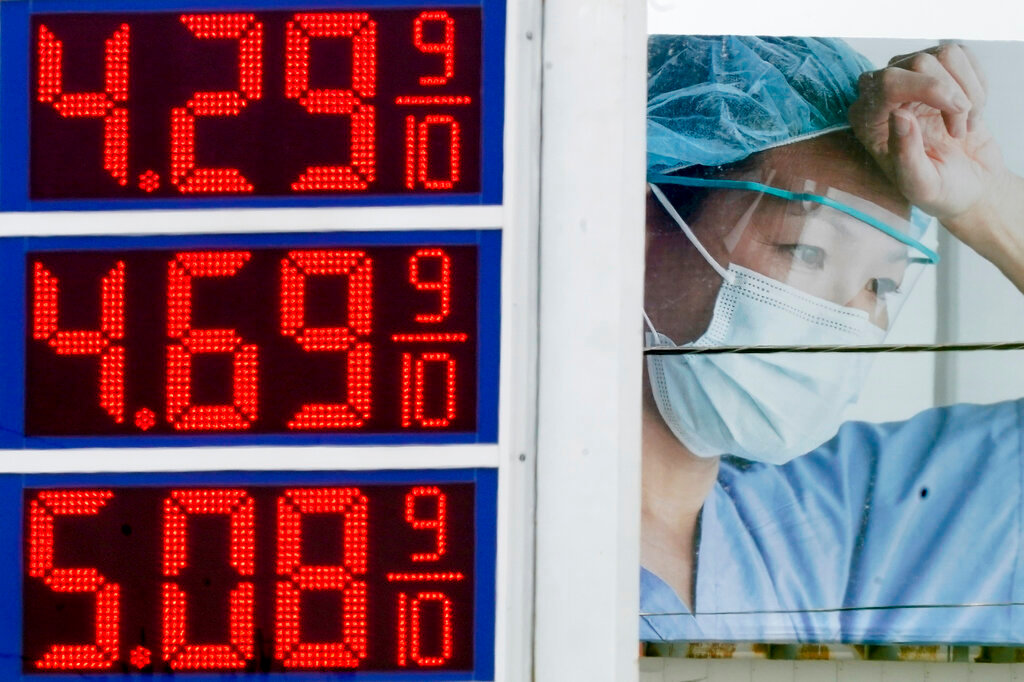 High gas prices are seen in front of a medical billboard on May 11, 2022, in Milwaukee. (AP Photo/Morry Gash, File)