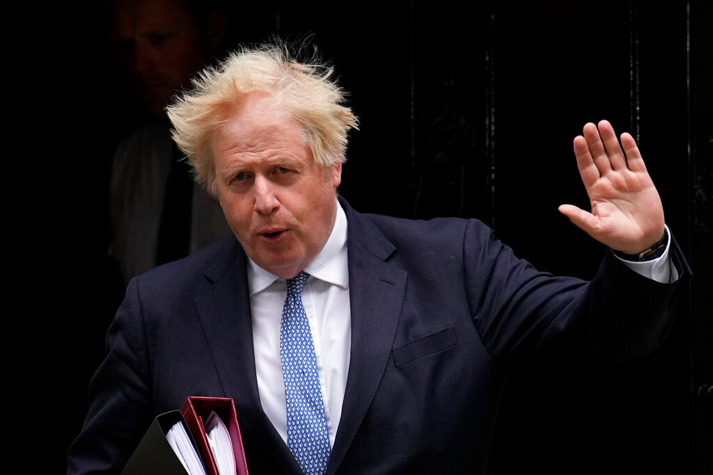British Prime Minister Boris Johnson leaves 10 Downing Street to attend the weekly Prime Minister's Questions at the Houses of Parliament, in London, Wednesday, May 25, 2022.  (AP Photo/Matt Dunham)