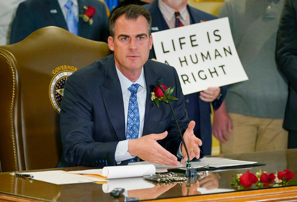 Oklahoma Gov. Kevin Stitt speaks after signing into law a bill making it a felony to perform an abortion, punishable by up to 10 years in prison in Oklahoma City, April 12, 2022.  (AP Photo/Sue Ogrocki, File)