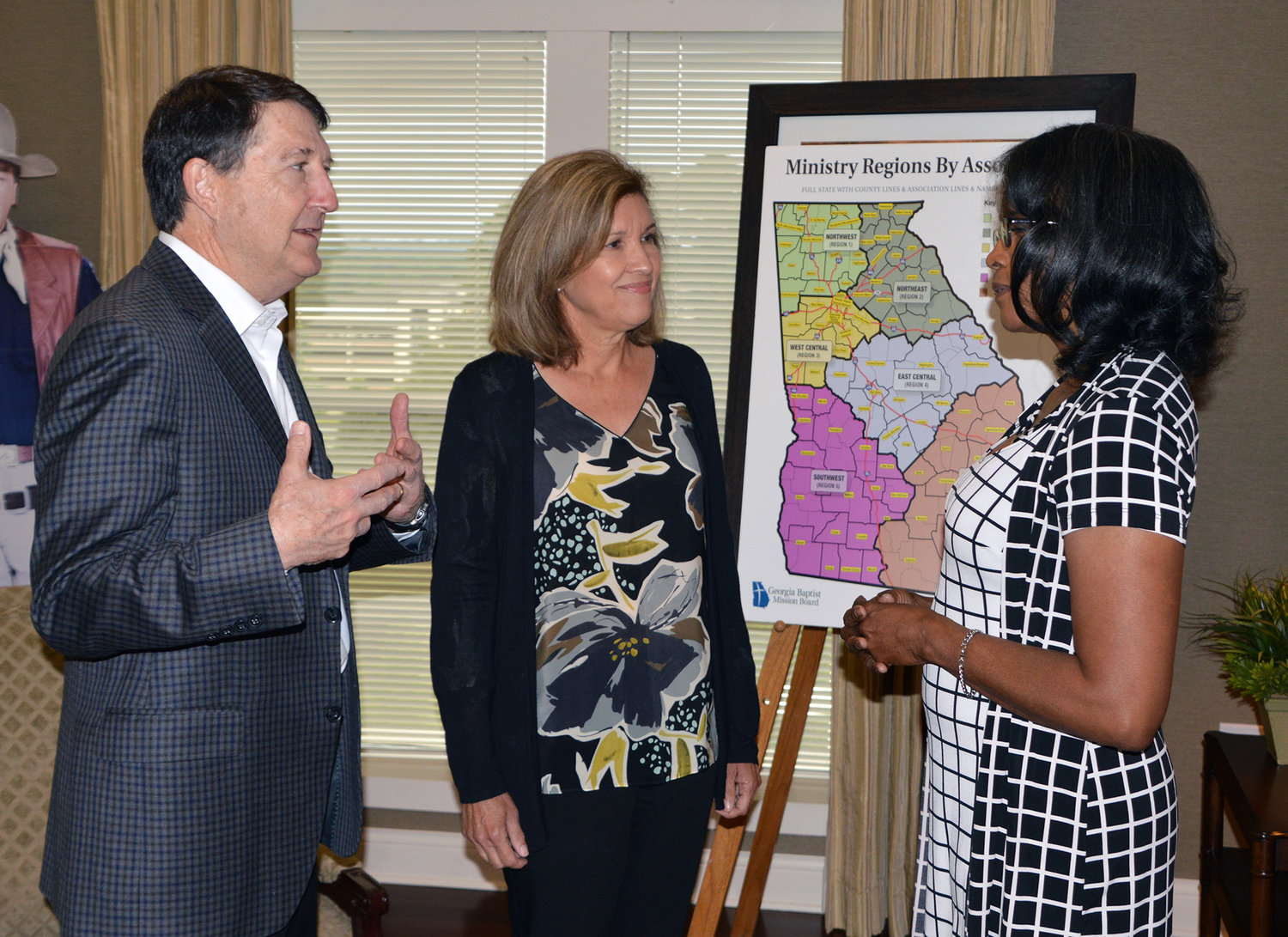 Tom Day, accompanied by his wife Martha, center, speaks with Daphne Nicely prior to a meeting at the Georgia Baptist Mission Board in Duluth, Ga., Tuesday, May 24, 2022. The Days are co-founders of The Vitamin Bridge, a nonprofit organization that’s supplying prenatal supplements to 28 organizations that minister to expectant mothers, including the The Atlanta Morning Center crisis pregnancy center. Nicely is executive director of The Atlanta Morning Center. (Index/Henry Durand)