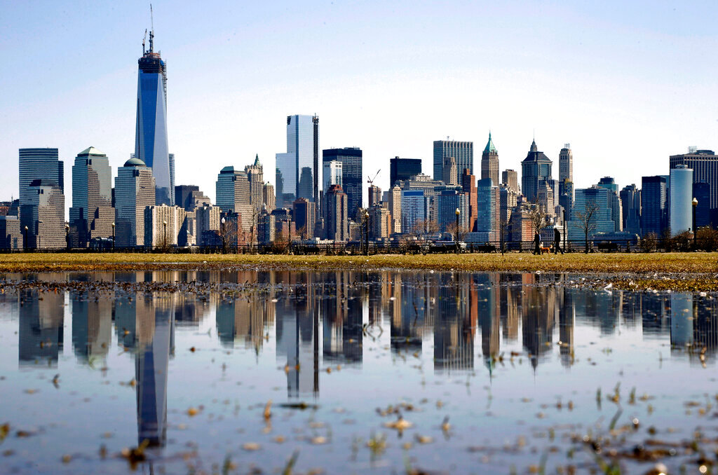 New York's Lower Manhattan skyline, including the One World Trade Center, left, is reflected in water on April 6, 2013, as seen from Liberty State Park in Jersey City, N.J. (AP Photo/Mel Evans, File)