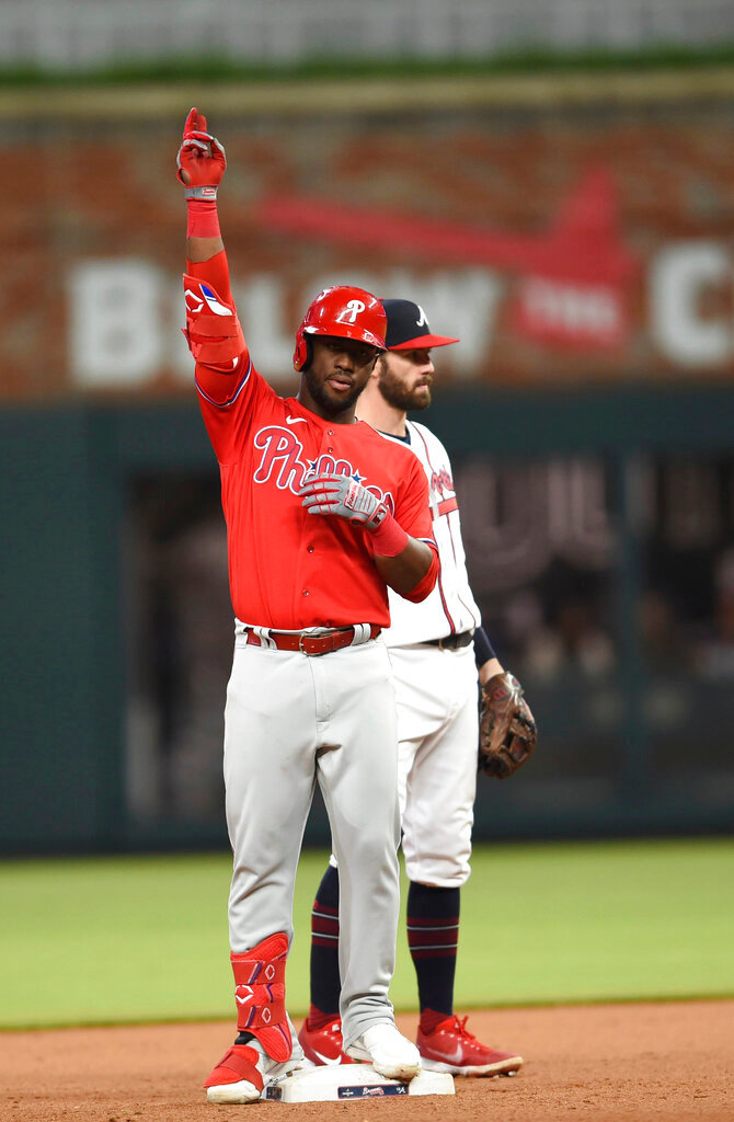 Philadelphia Phillies' Odubel Herrera (37) gestures after hitting a two-run double against the Atlanta Braves during the seventh inning Thursday, May 26, 2022, in Atlanta. (AP Photo/Hakim Wright Sr.)