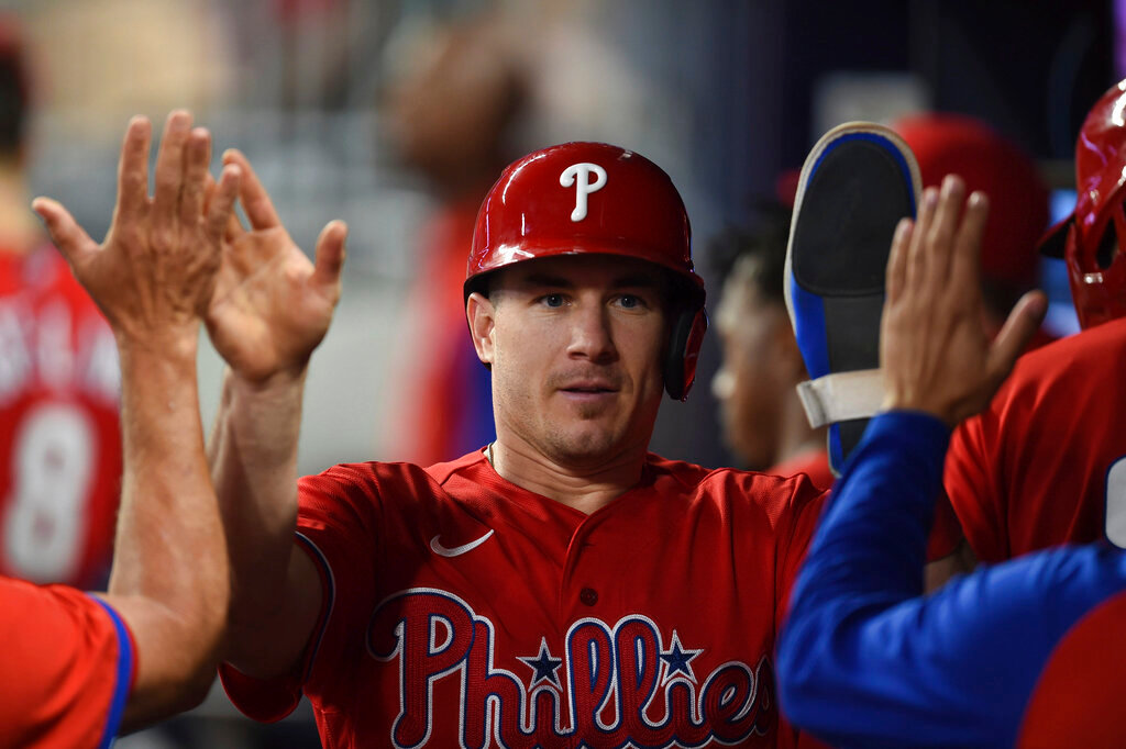 Philadelphia Phillies J.T. Realmuto high-fives teammates after scoring on double by Odubel Herrera during the seventh inning against the Atlanta Braves on Thursday, May 26, 2022, in Atlanta. (AP Photo/Hakim Wright Sr.)