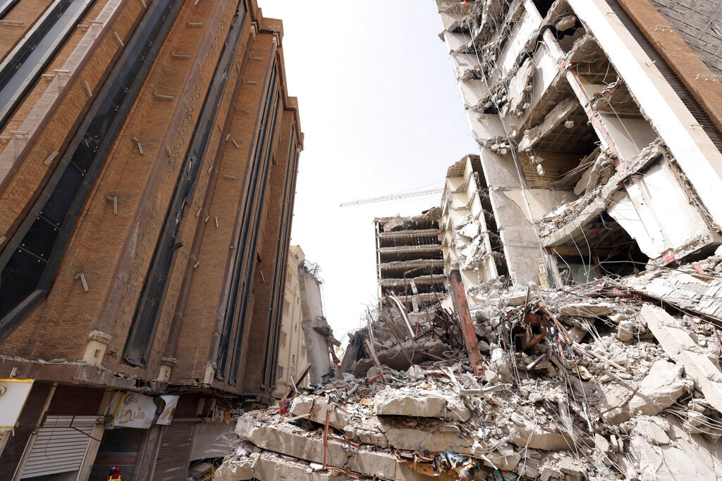 The ruins of a collapsed building are seen in the southwestern city of Abadan, Iran. (Iranian Senior Vice-President Office via AP)