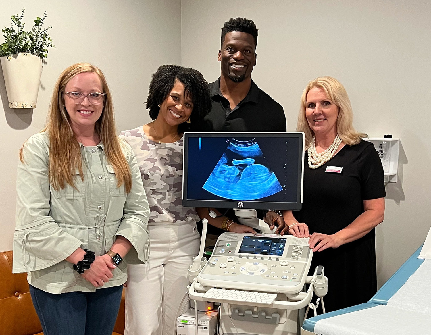 Benjamin and Kirsten Watson join the ERLC's Elizabeth Graham, left, and center director Cindy Coggin-Hughes, right, with the ultrasound machine the Watsons donated in partnership with the Psalm 139 Project to Coweta Pregnancy Services in Newnan, Ga.