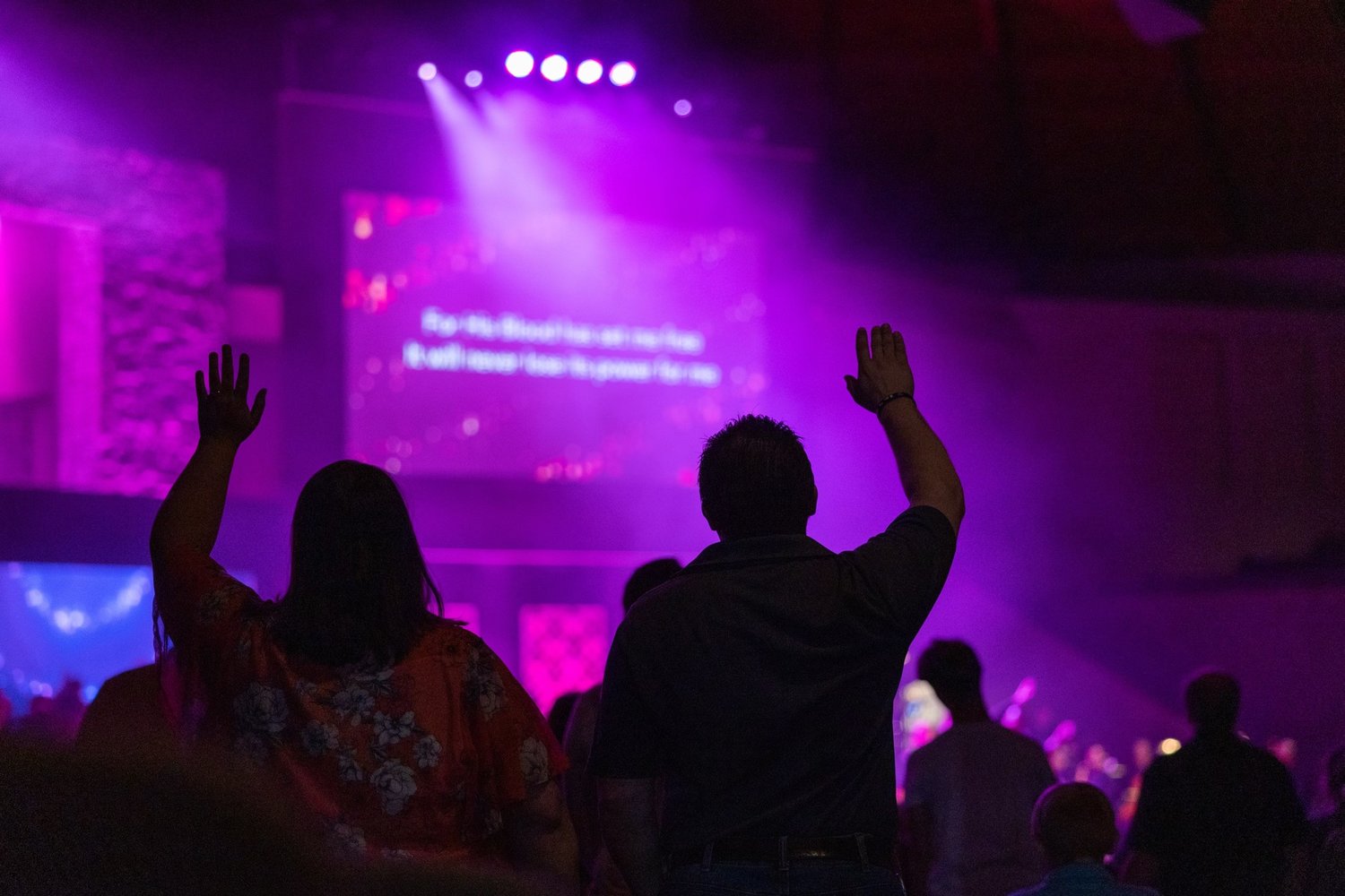 Worshippers praise the Lord during a service at the Fayetteville church.