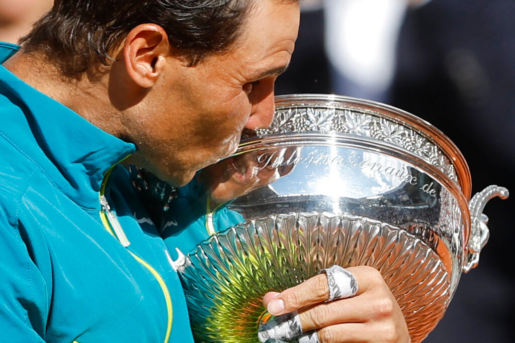 Spain's Rafael Nadal kisses the cup after defeating Norway's Casper Ruud in the final match of the French Open tennis tournament Sunday, June 5, 2022 in Paris. (AP Photo/Jean-Francois Badias)