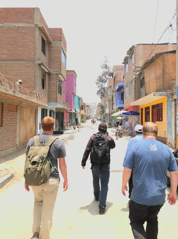 From left, Joe Fraser, associate pastor at Briarwood BC in Watkinsville, translator Javier Jurado, and Rick Howard, Mission Team Leader at Summit Church in Loganville walk through the streets in Ville El Salvador, a district in the Lima Region, on the way to visit a new church in the fall of 2021.