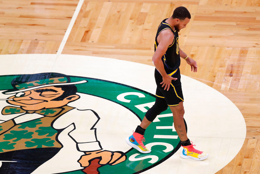 Golden State Warriors guard Stephen Curry (30) walks down the court against the Boston Celtics during the third quarter of Game 3 of the NBA Finals, Wednesday, June 8, 2022, in Boston. (AP Photo/Michael Dwyer)