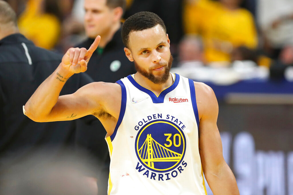 Golden State Warriors guard Stephen Curry (30) celebrates during the second half of Game 5 of the NBA Finals against the Boston Celtics in San Francisco, Monday, June 13, 2022. (AP Photo/Jed Jacobsohn)
