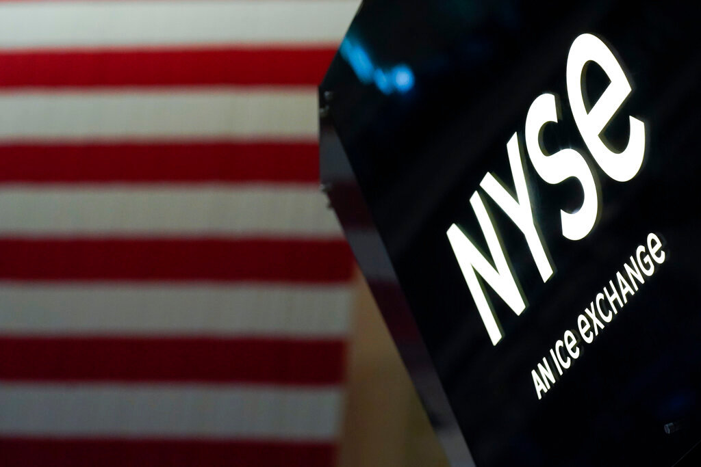An NYSE sign is seen on the floor at the New York Stock Exchange in New York, Wednesday, June 15, 2022. (AP Photo/Seth Wenig)