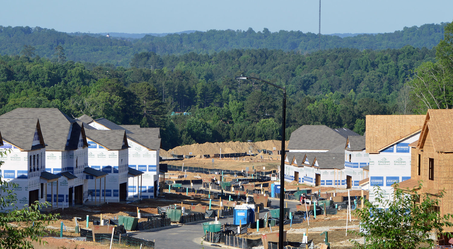 Houses under construction line the street of a new subdivision in Dallas, Ga., June 10, 2022. (Index/Henry Durand)