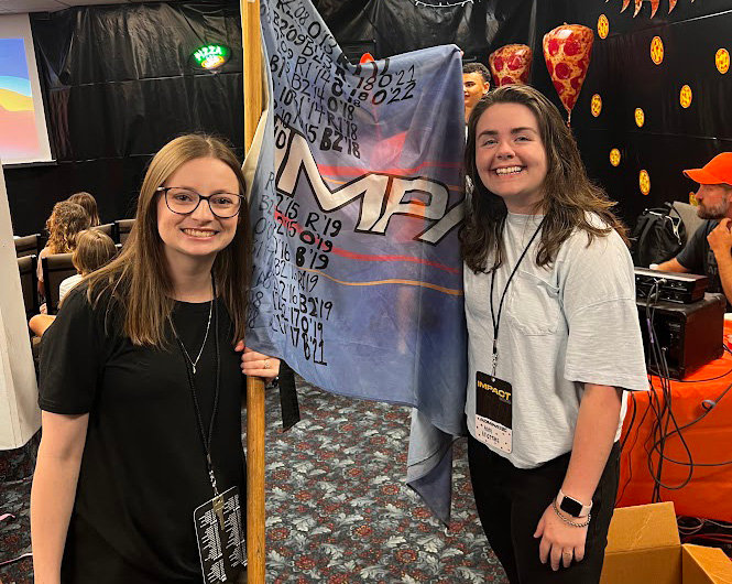 "Orange School" won the first spirit flag of Impact for middle school. Abby Everett and Abbi Andrews accepted it for their school.