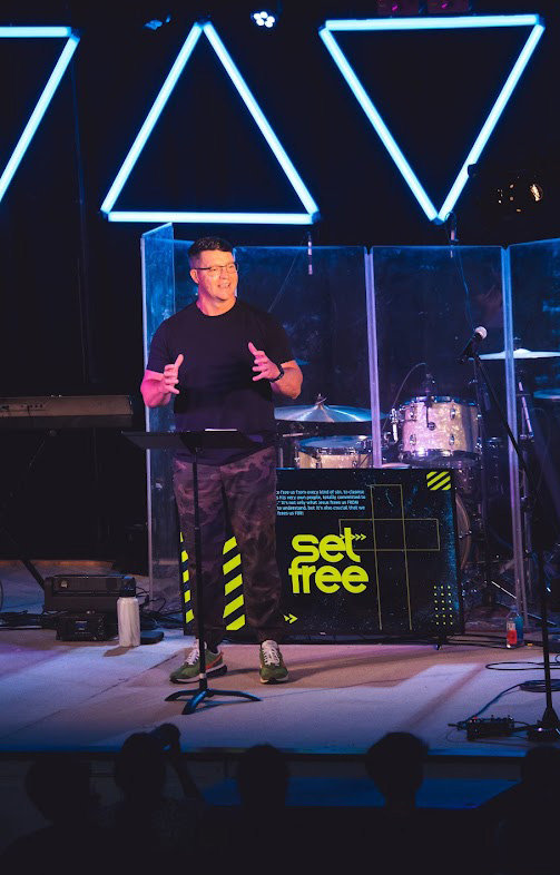 Camp Pastor Andy Blanks preaches from Romans 8 from the main stage.