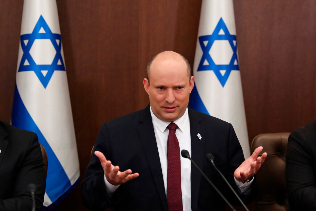 Israeli Prime Minister Naftali Bennett attends a cabinet meeting at the Prime Minister's office in Jerusalem, Sunday, June 19, 2022. Bennett’s office announced Monday, June 20, 2022, that his weakened coalition will be disbanded and the country will head to new elections. Bennett has struggled to keep his unruly coalition of eight parties together, and defections have left the crumbling alliance without a majority in parliament for over two months. (Abir Sultan/Pool Photo via AP, File)