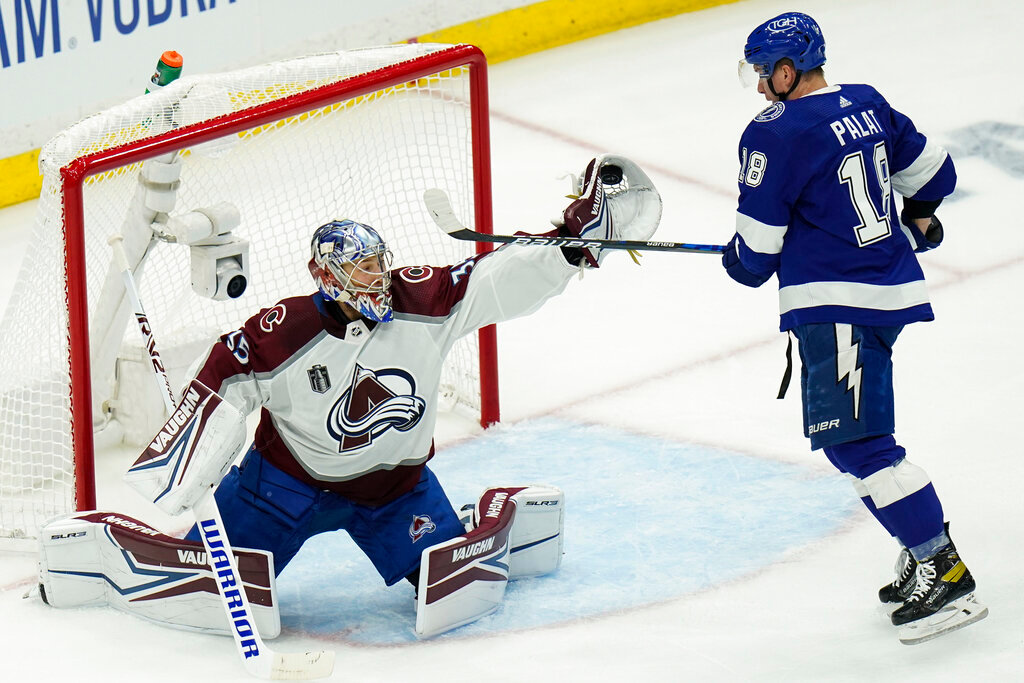 Colorado Avalanche goaltender Darcy Kuemper makes a save on a shot from Tampa Bay Lightning left wing Ondrej Palat during the first period of Game 3 of the NHL Stanley Cup Final on Monday, June 20, 2022, in Tampa, Fla. (AP Photo/Chris O'Meara)