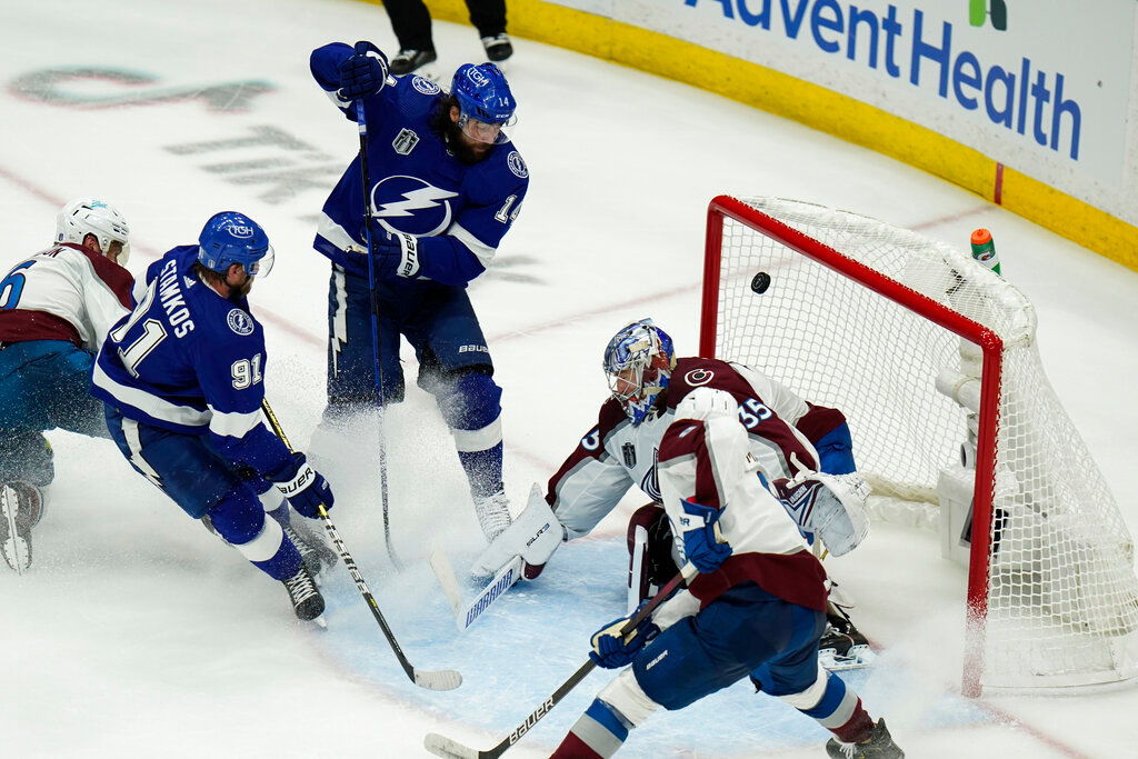 Tampa Bay Lightning left wing Pat Maroon (14) scores past Colorado Avalanche goaltender Darcy Kuemper (35) during the second period of Game 3 of the NHL Stanley Cup Final on Monday, June 20, 2022, in Tampa, Fla. (AP Photo/Chris O'Meara)