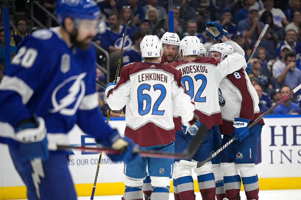 The Colorado Avalanche celebrate a goal by center Nathan MacKinnon during the second period of Game 4 of the NHL Stanley Cup Finals against the Tampa Bay Lightning on Wednesday, June 22, 2022, in Tampa, Fla. (AP Photo/Phelan Ebenhack)