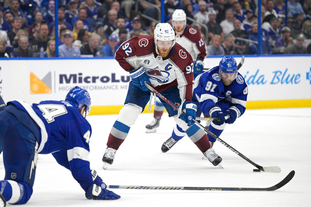 Colorado Avalanche left wing Gabriel Landeskog takes a shot during the second period of Game 4 of the NHL Stanley Cup Finals against the Tampa Bay Lightning on Wednesday, June 22, 2022, in Tampa, Fla. (AP Photo/Phelan Ebenhack)