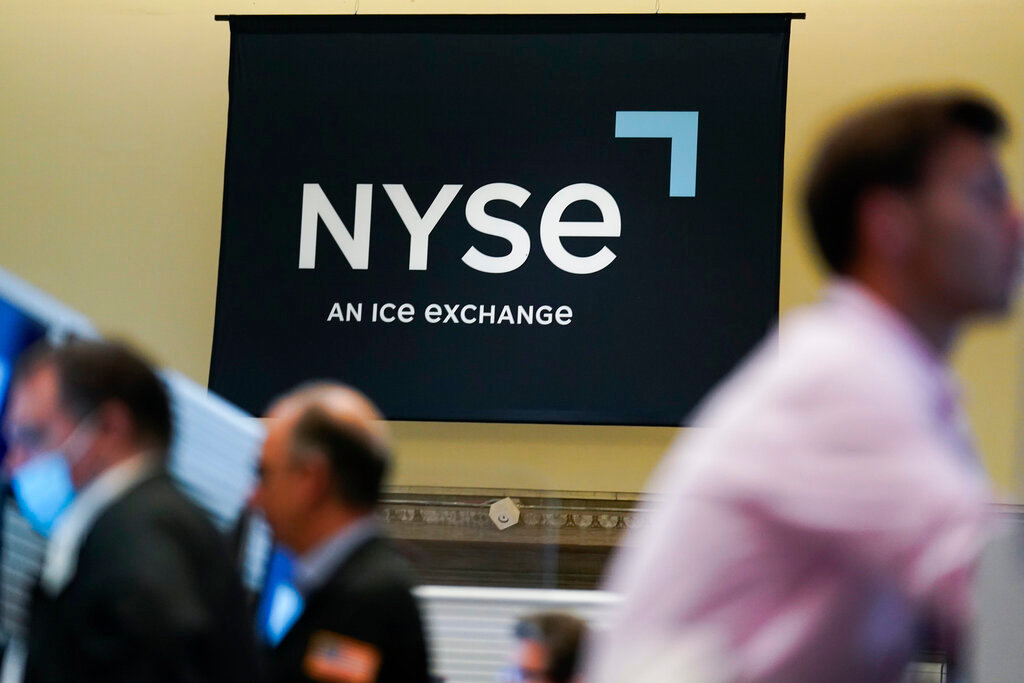 An NYSE sign is seen on the floor at the New York Stock Exchange in New York, Wednesday, June 15, 2022. (AP Photo/Seth Wenig)