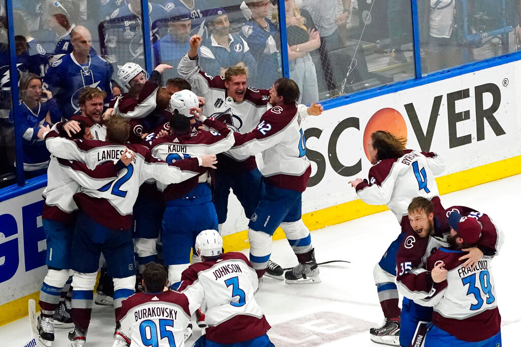 The Colorado Avalanche celebrate after defeating the Tampa Bay Lightning to win the NHL Stanley Cup Finals on Sunday, June 26, 2022, in Tampa, Fla. (AP Photo/John Bazemore)