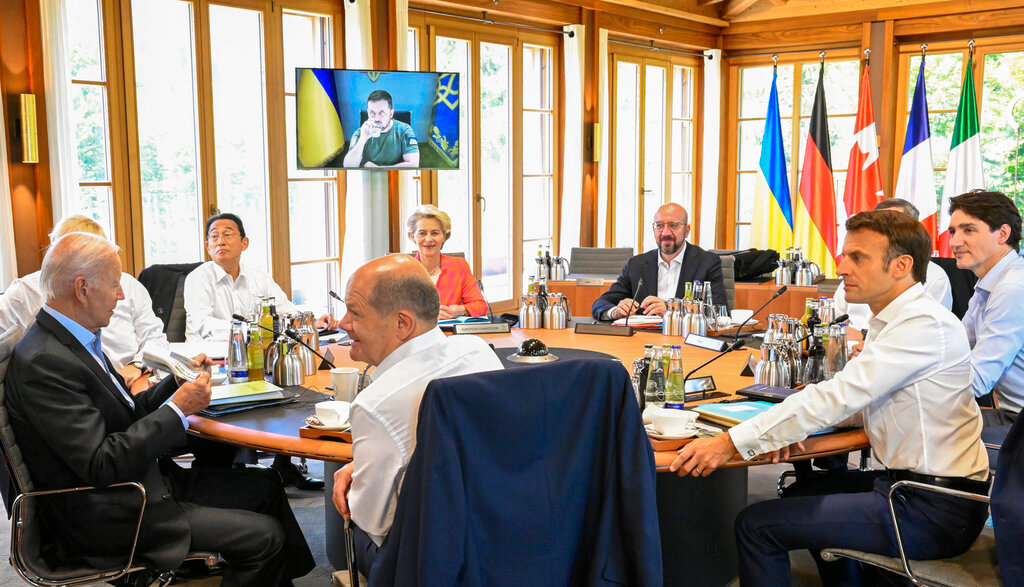Group of Seven leaders listen as Ukraine's President Volodymyr Zelensky addresses them via video link during their working session at Castle Elmau in Kruen, near Garmisch-Partenkirchen, Germany, on Monday, June 27, 2022. (Tobias Schwarz/Pool Photo via AP)