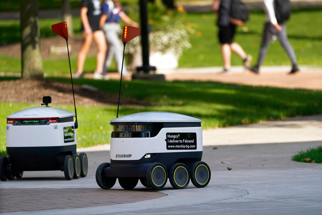 Robots navigate the Bowling Green State University campus in Bowling Green, Ohio on Oct. 13, 2021. (AP Photo/Carlos Osorio)