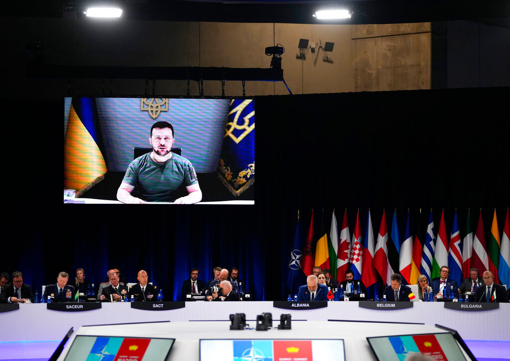Ukraine's President Volodymyr Zelenskyy addresses leaders via a video screen during a round table meeting at a NATO summit in Madrid, Wednesday, June 29, 2022. (AP Photo/Manu Fernandez)