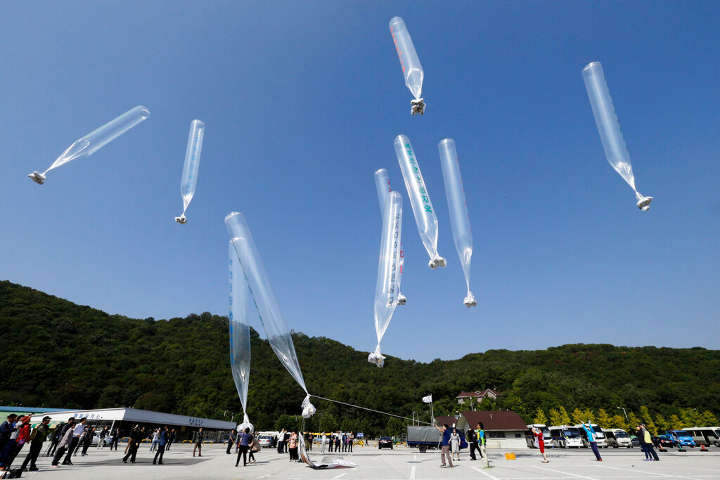 North Koran defectors release balloons carrying leaflets condemning North Korean leader Kim Jong Un and his government's policies, in Paju, near the border with North Korea, South Korea on  Oct. 10, 2014. (AP Photo/Ahn Young-joon, File)